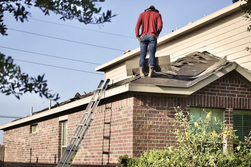 Professional roofer working on a residential roof in Palomar